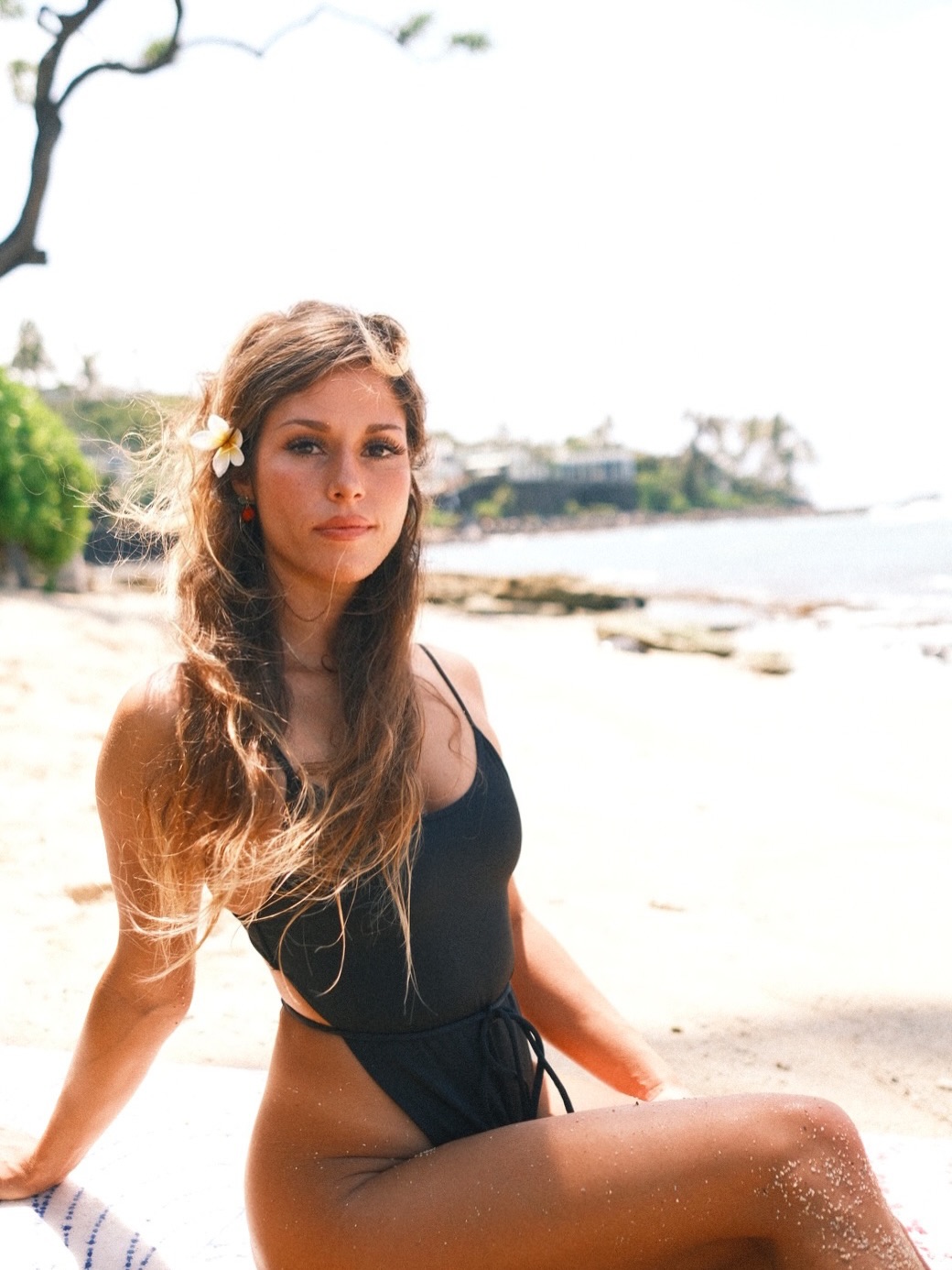 Hella sitting beside the beach